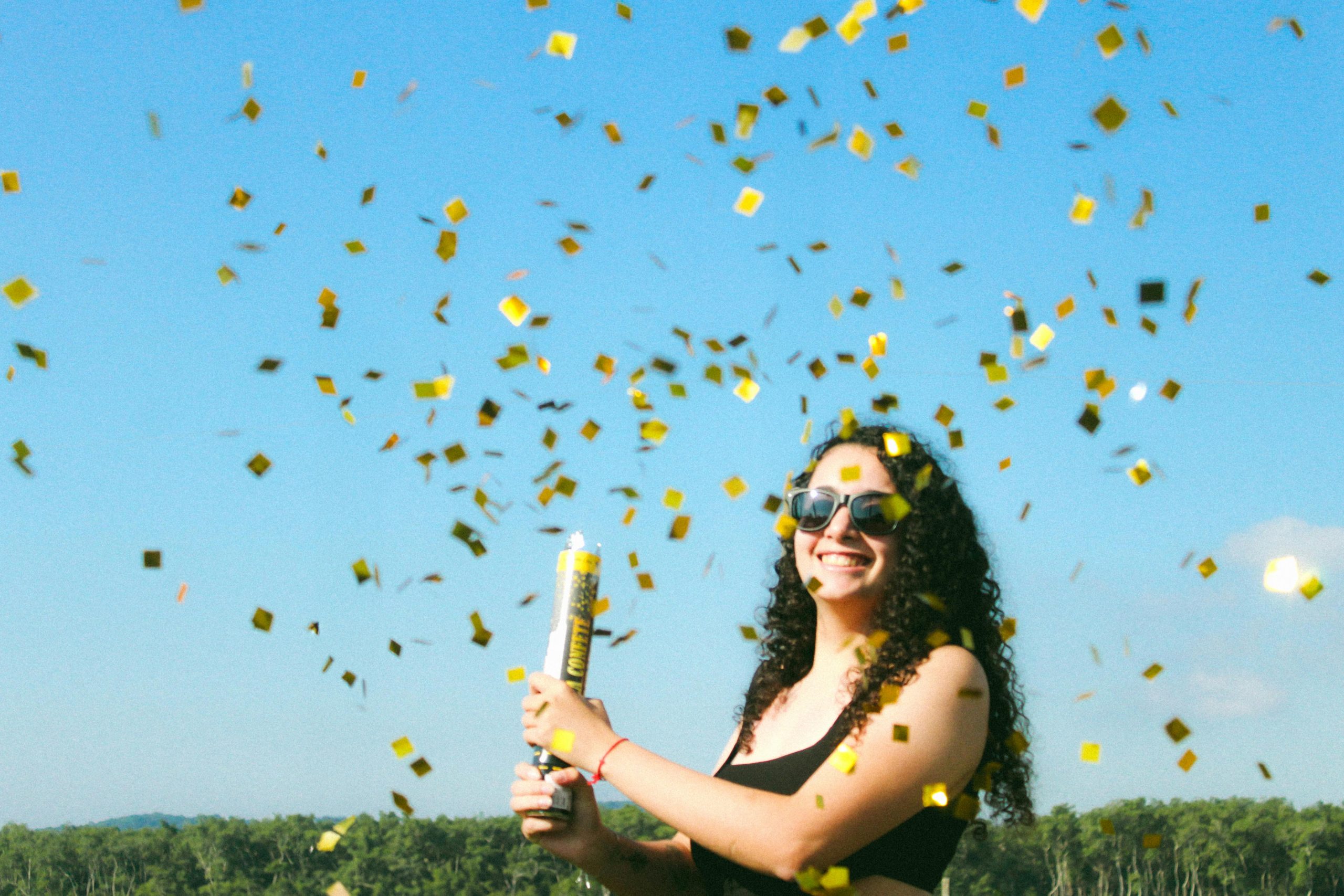 lady pulling a confetti cannon
